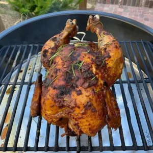 Delicious beer can chicken ready to be served on the grill.