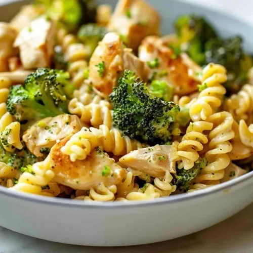 Rotisserie chicken broccoli pasta dish with savory ingredients