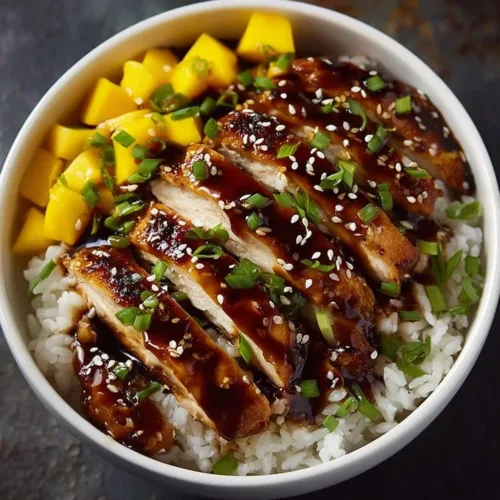 Delicious Asian mango glazed chicken served on a plate with vegetables