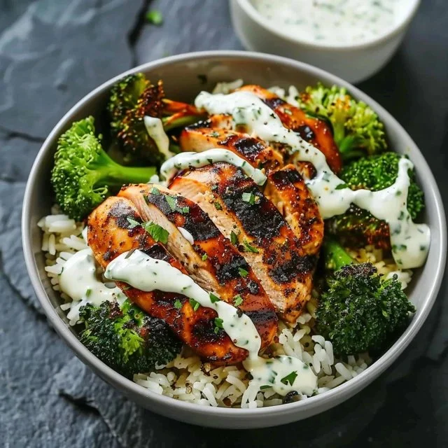 Healthy grilled chicken broccoli bowls with vibrant veggies and seasoning