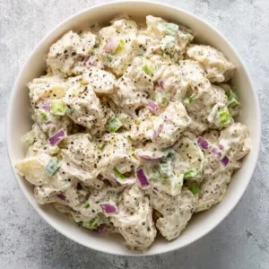 Healthy chicken salad with fresh ingredients and vibrant colors