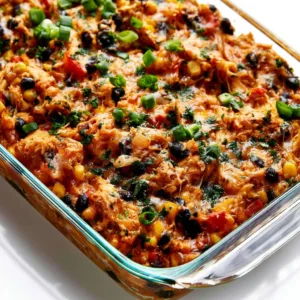 A delicious easy chicken burrito casserole topped with cheese and fresh ingredients.