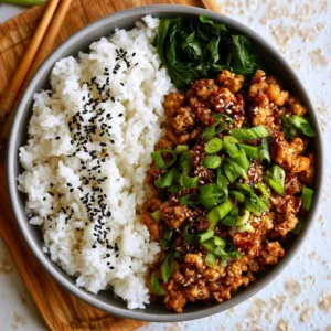 Healthy Asian Ground Chicken Rice Bowl with colorful vegetables over rice