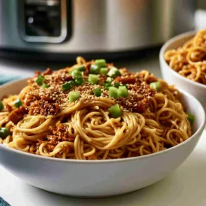 Delicious Crockpot Honey Garlic Chicken Noodles served in a bowl.