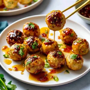 Delicious honey garlic chicken meatballs served in a bowl with garnish