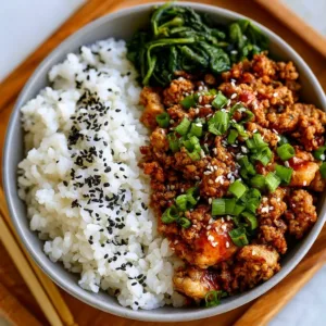 Delicious ground chicken bowl with colorful vegetables and seasonings