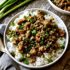 Healthy sesame ground chicken recipe served in a bowl with vegetables.